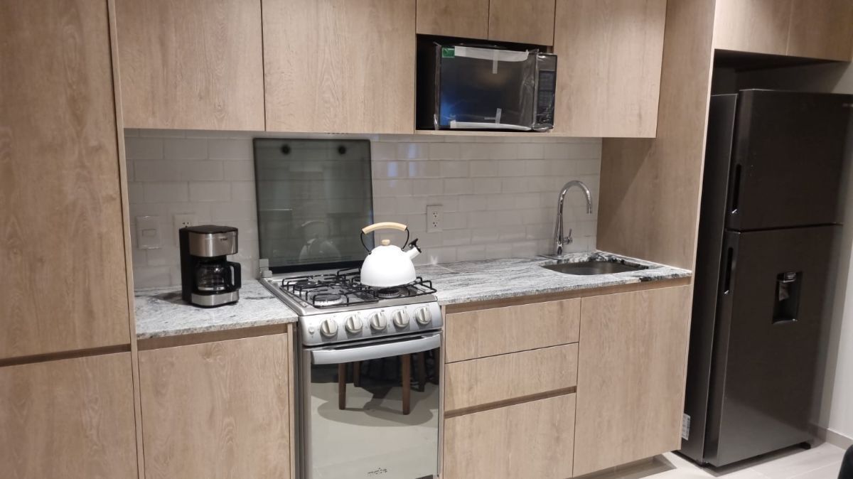 Cocina integral equipada con granito
